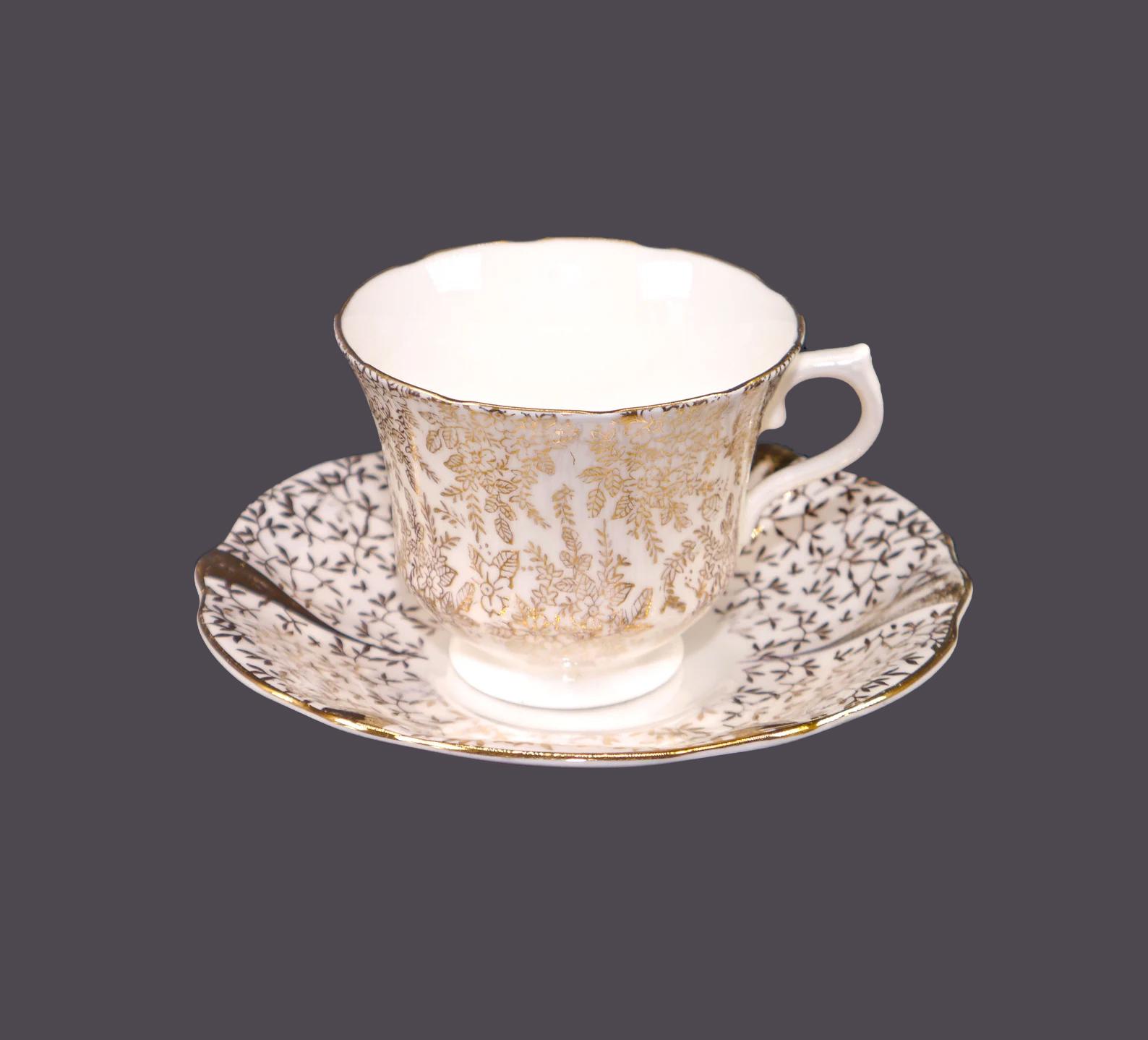 Gold-colored vintage porcelain teacup and saucer set