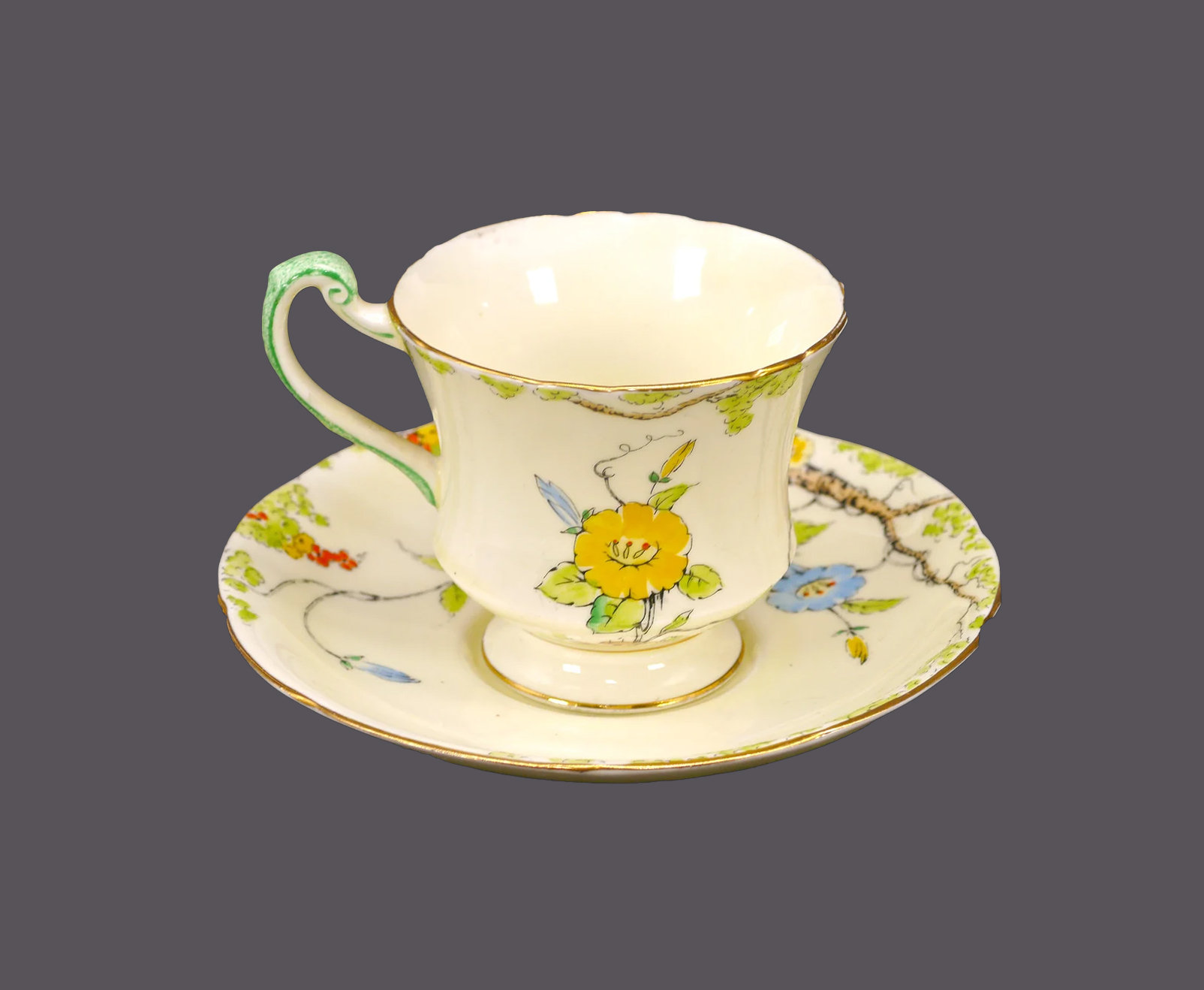 Yellow and blue floral pattern teacup and saucer set